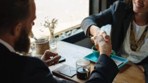 man and woman shaking hands